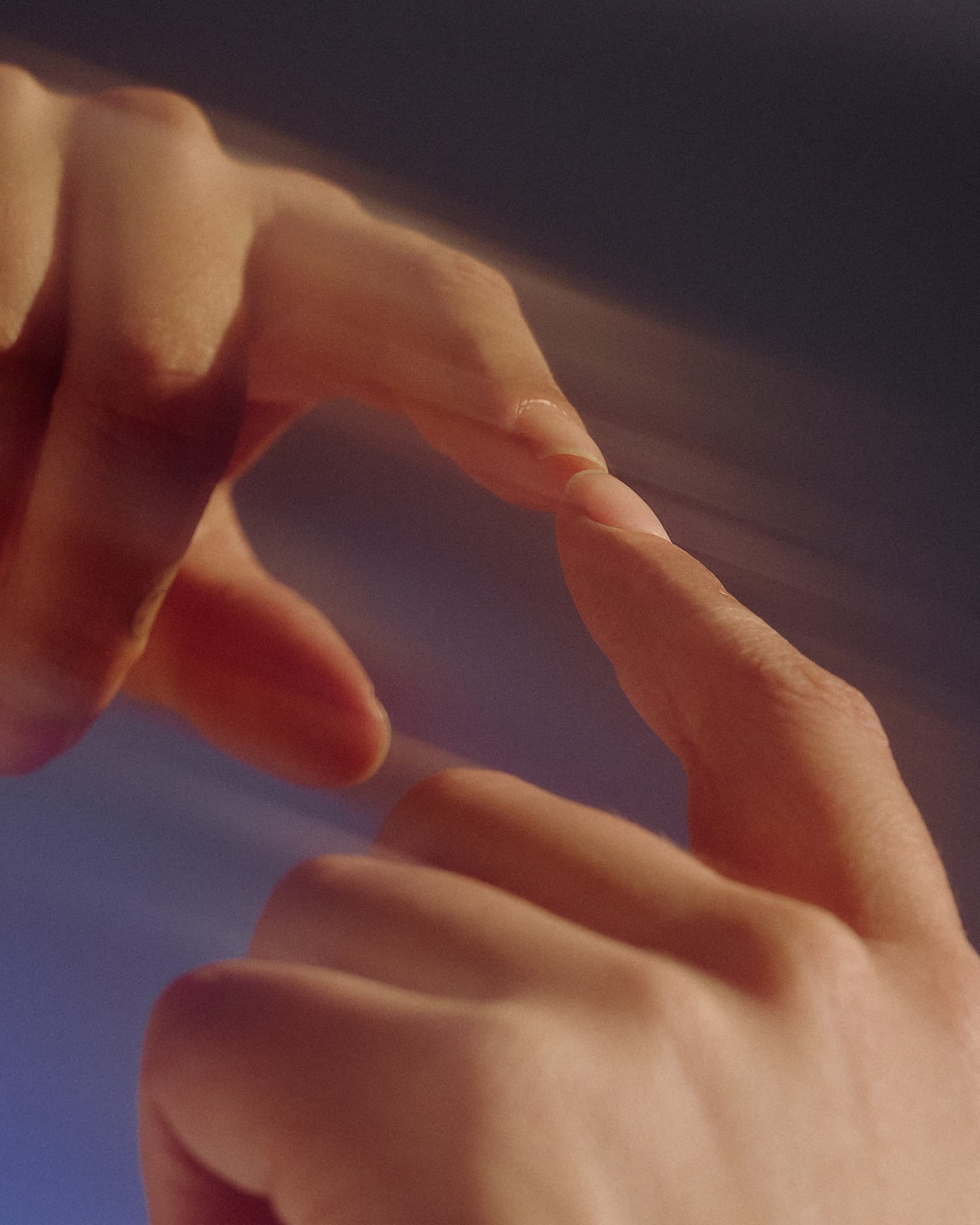Two hands reaching toward each other